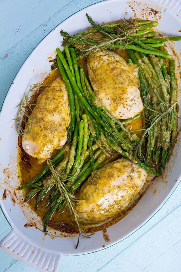 Top down shot of Lemon Chicken with Rosemary & Asparagus in white pan