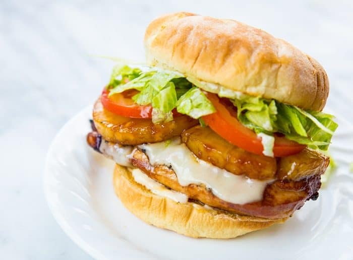 Teriyaki Chicken Burger loaded with fillet, pineapple slices, Swiss cheese, tomato slices and shredded lettuce