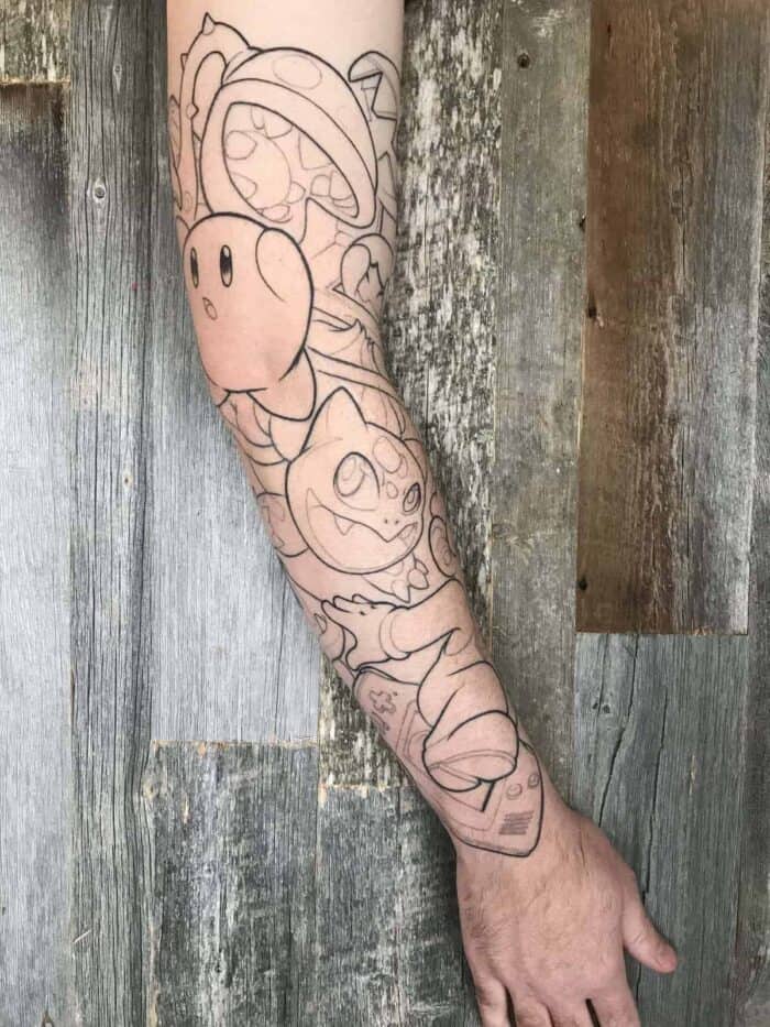 An Arm with full Sleeve Tattoo of Nintendo characters