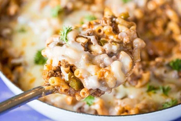 a spoon full of Sloppy Joe Mac & Cheese from a skillet