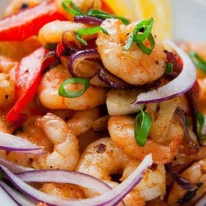 close up of Garlic Shrimp Stir-Fry with Peppers & Onions in a white bowl