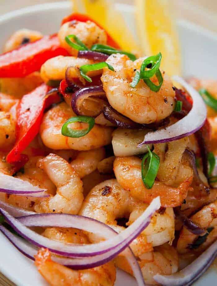 close up of Garlic Shrimp Stir-Fry with Peppers & Onions in a white bowl