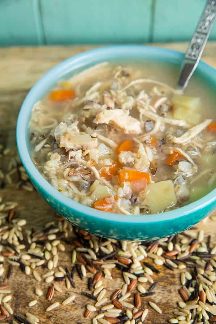 no dairy Chicken & Wild Rice Soup in a jade blue soup bowl