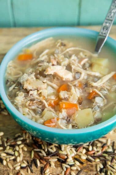 no dairy Chicken & Wild Rice Soup in a jade blue soup bowl