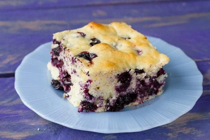 Lemon Blueberry Overnight Breakfast Cake in a blue dessert plate