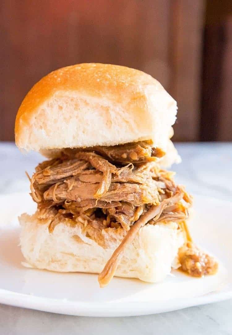 close up Slow Cooker Pulled Pork on toasted buns