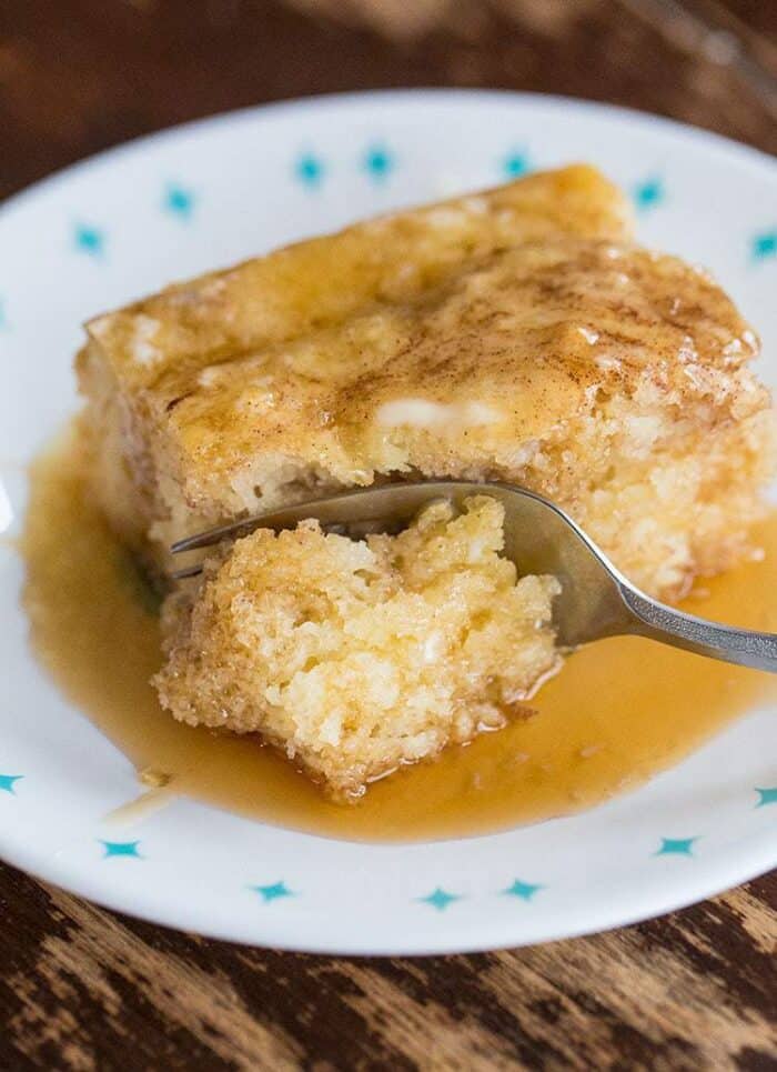 a plate with a slice of baked pancake with syrup ready for breakfast