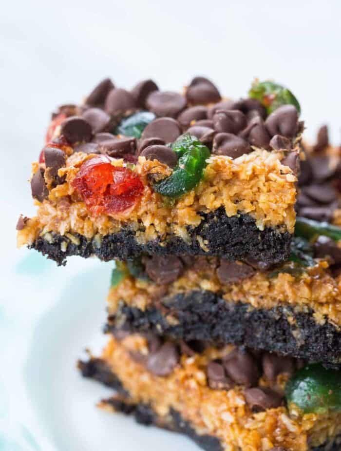 close up stack of Christmas Magic Cookie Bars slices