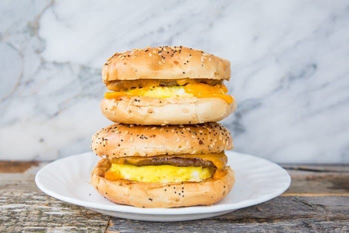 Sausage & Egg Breakfast Bagels in a white plate