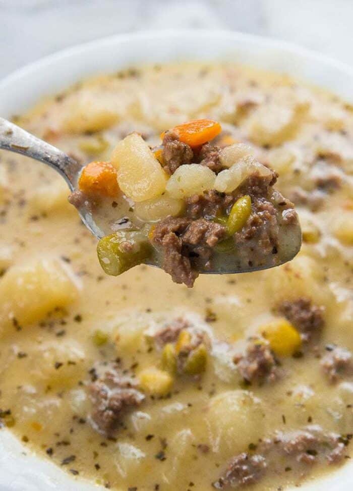 creamy potato hamburger soup in a white bowl