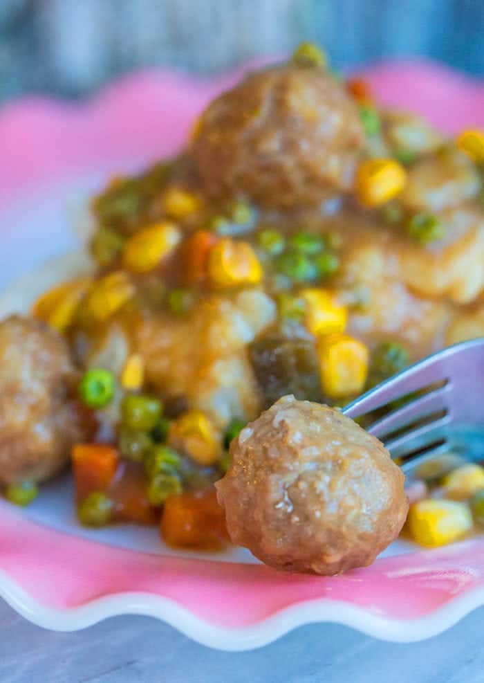 Close up of Crockpot Meatball Shepherd's Pie in pink ruffle plate