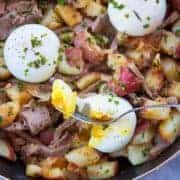 Close up of Leftover Prime Rib in a Skillet with Poached Eggs