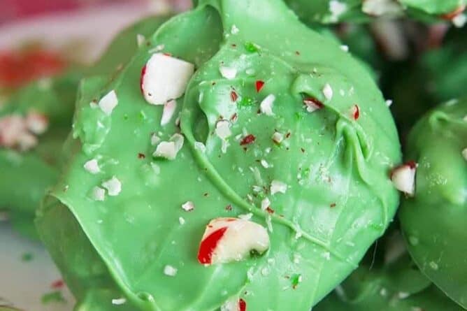 Minty Grinch Crock Pot Candy sprinkled with broken candy cane
