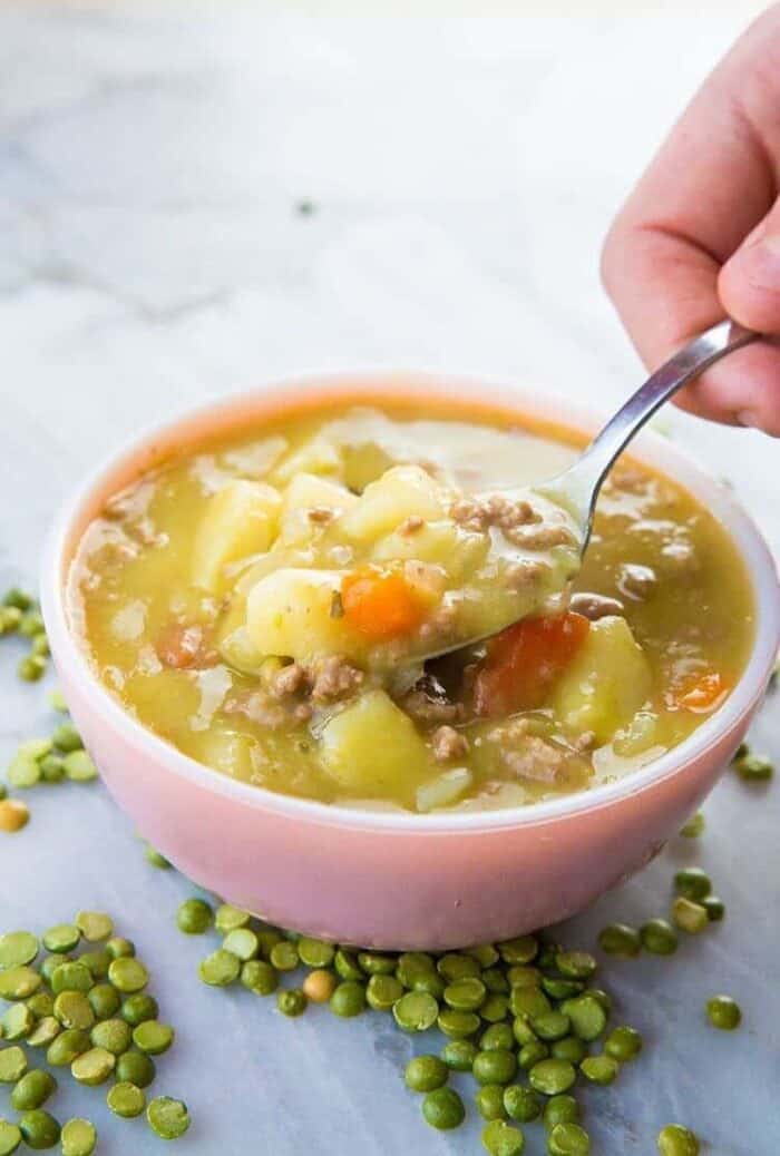 creamy hamburger split pea soup in a vintage pink bowl