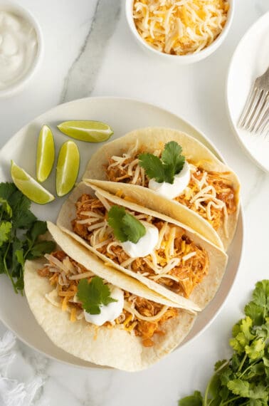 crockpot chicken fajitas on a white plate looking from above