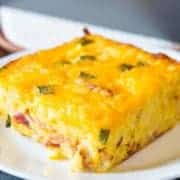 Double Cheese Overnight Breakfast Hashbrown Casserole in a white plate