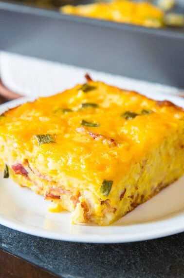 Double Cheese Overnight Breakfast Hashbrown Casserole in a white plate