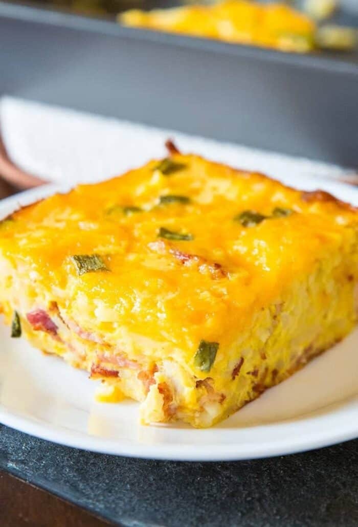 Double Cheese Overnight Breakfast Hashbrown Casserole in a white plate