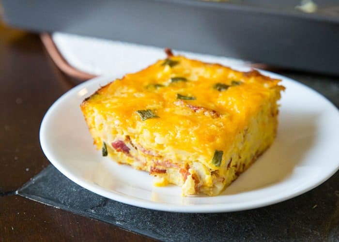 Slice of Hash brown Casserole in a small white plate