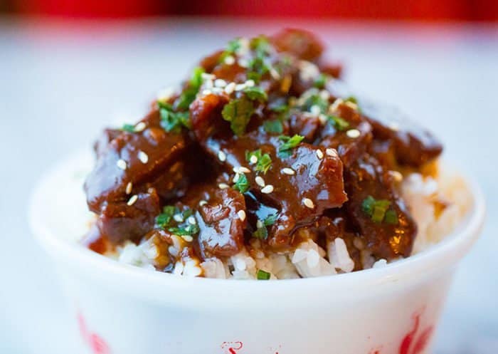 a bowl of rice topped with Instant Pot Mongolian Beef 