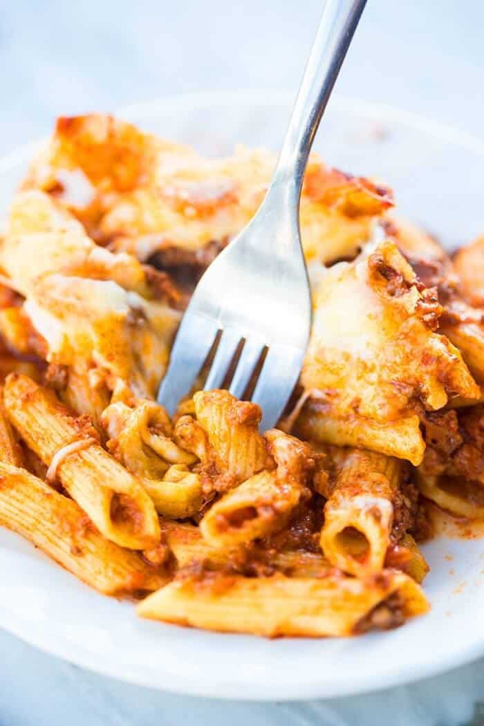 close up of Slow Cooker Baked Ziti in serving plate with fork