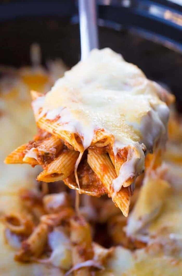 slow cooker baked ziti on a spoon