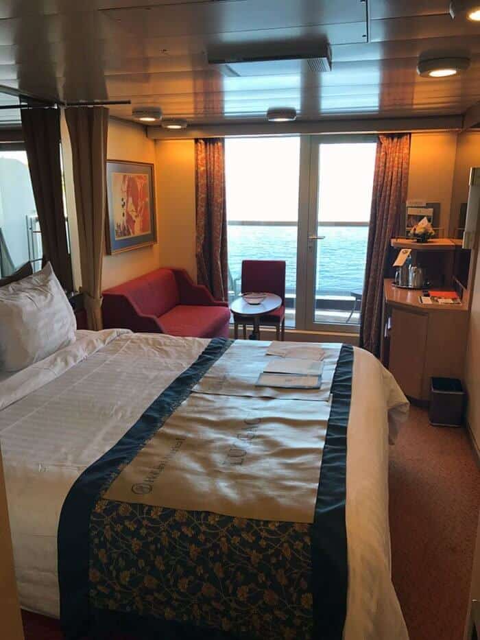 the balcony room with good amount of space and a view of water outside
