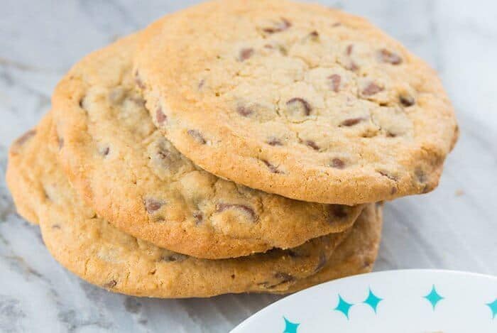 Stack of Mrs Fields Blue Ribbon Chocolate Chip Cookies on Marble background