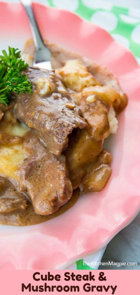 This Mushroom Crock Pot Cube Steak & Gravy simmers all day long and turns tough cube steak into a decadent, gravy drenched dinner! #cubesteak #crockpot #dinner