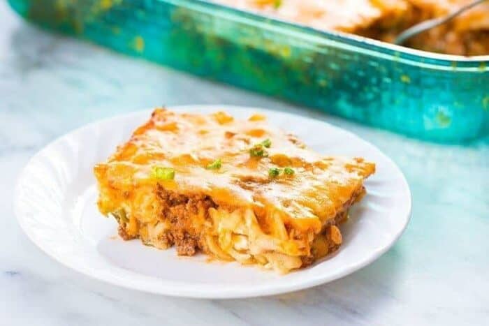 Slice of Sour Cream Ground Beef Noodle Casserole in a White Plate