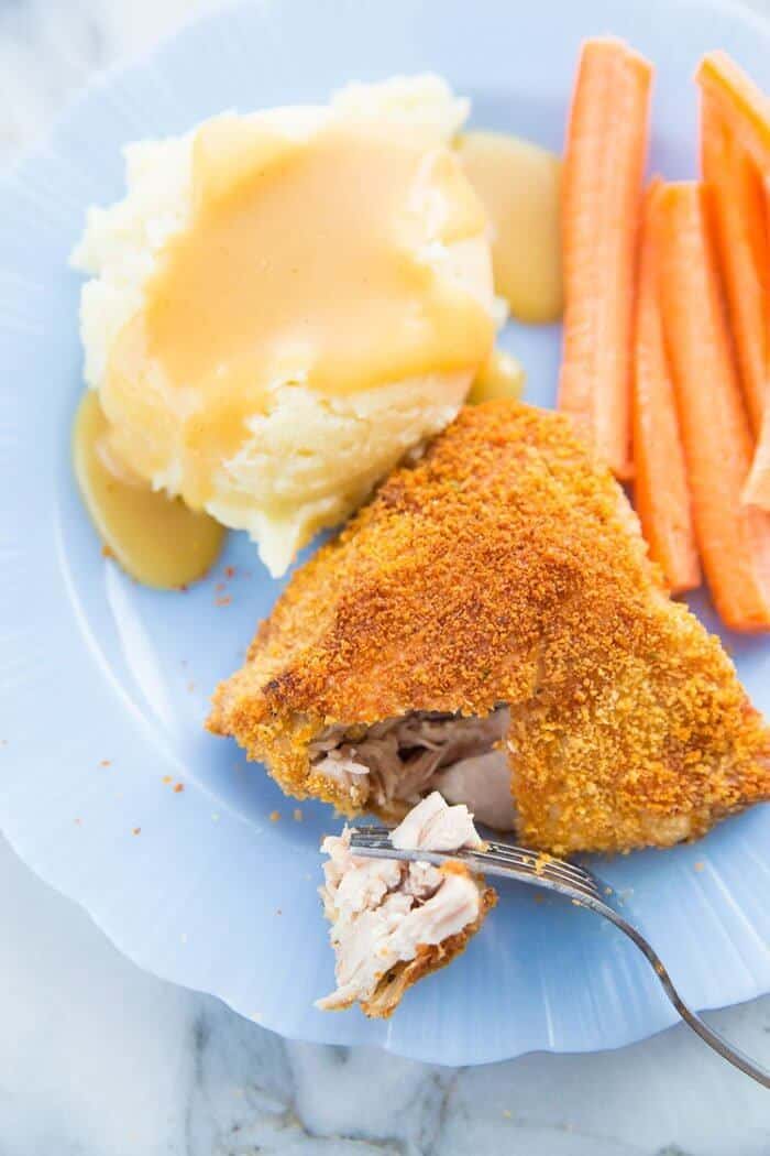 Tender, Crispy Oven Baked Chicken Thigh on a plate with mashed potato