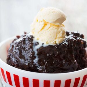 Close up of Chocolate Slow Cooker Lava Cake in a Bowl Topped with vanilla ice cream