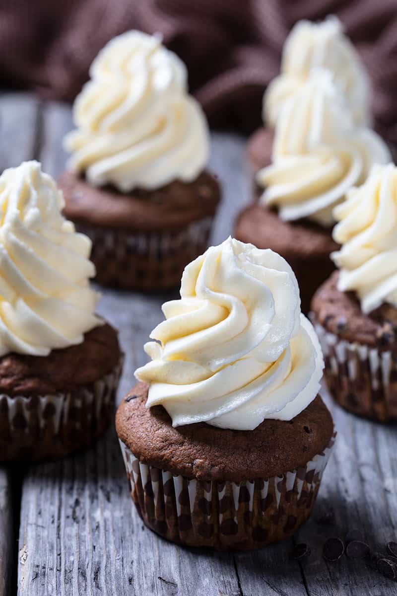 chocolate cupcakes topped with a swirl of buttercream frosting