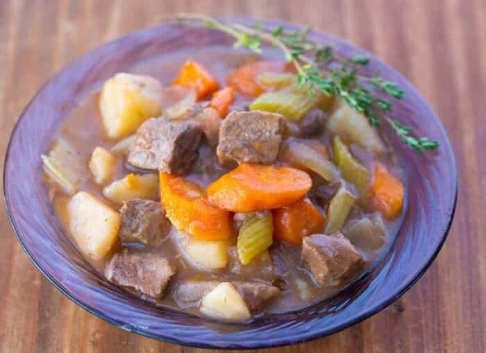 Beef Stew with Red Wine and fresh thyme in Purple bowl