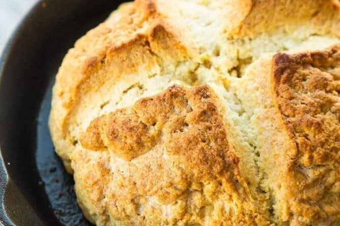 Close up of Irish Soda Bread in Large Red Skillet