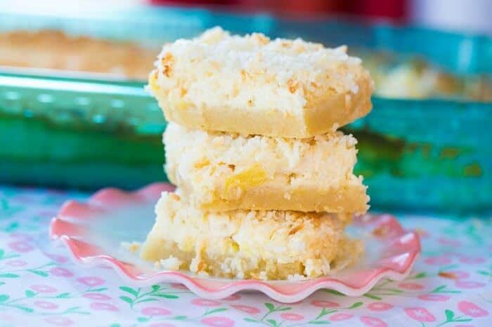 Stack of Cheesecake Bars in a pink ruffle plate