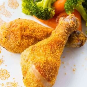 Crispy Oven Baked Chicken Legs on a vintage Corelle Butterfly Gold Plate