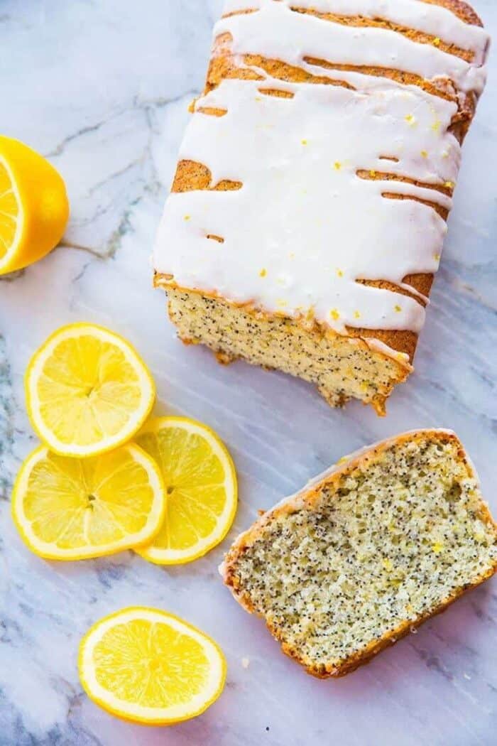 Lemon Poppy Seed Loaf Cake with Lemon Icing Glaze with close up of top of loaf cake 
