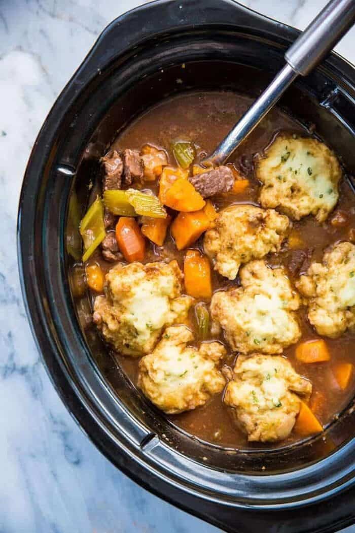 top down view of a Slow Cooker Beef & Sweet Potato Stew in a marble background