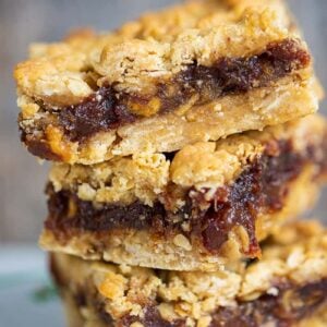 close up stack of Date Bars in a small white plate