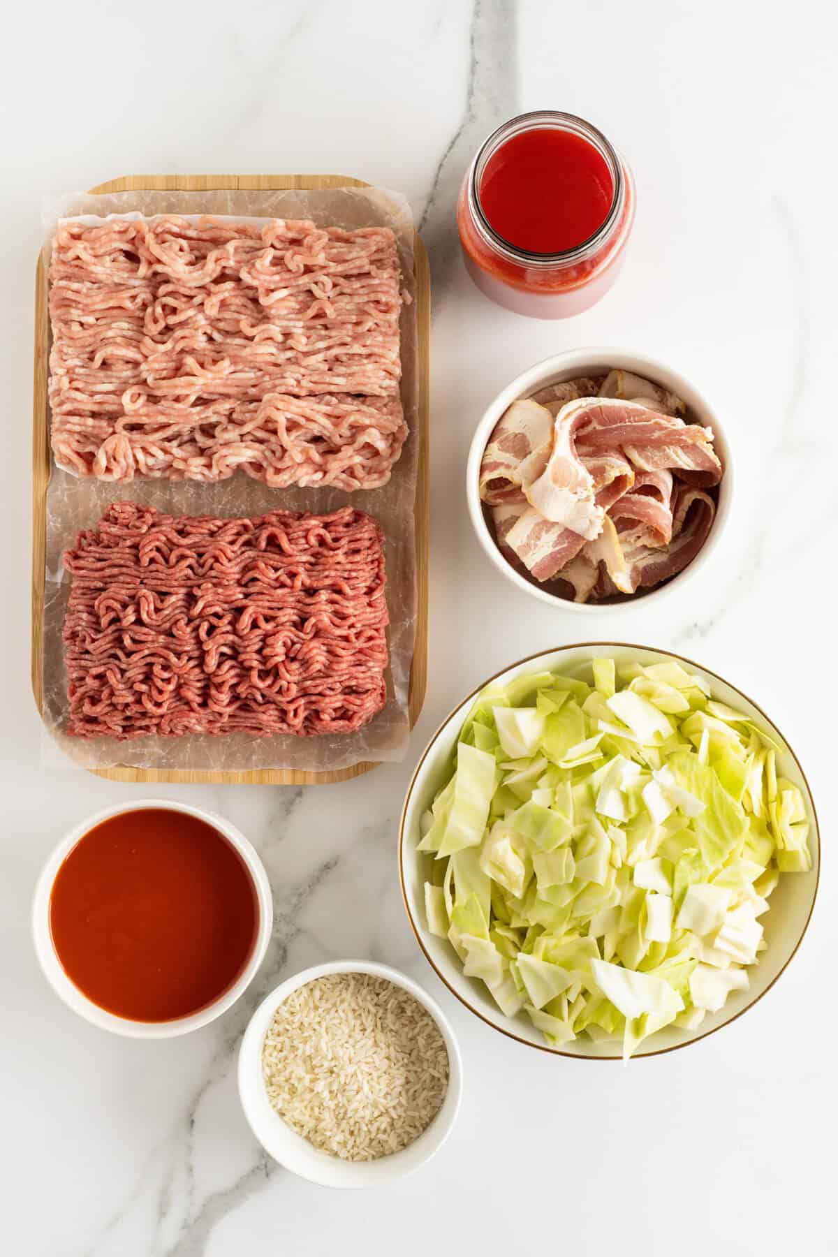 lazy cabbage casserole ingredients in small white bowls
