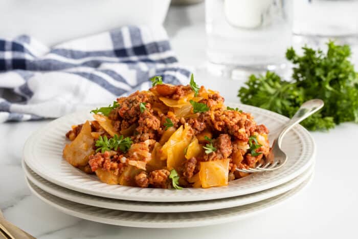 lazy cabbage casserole on a stack of white plates