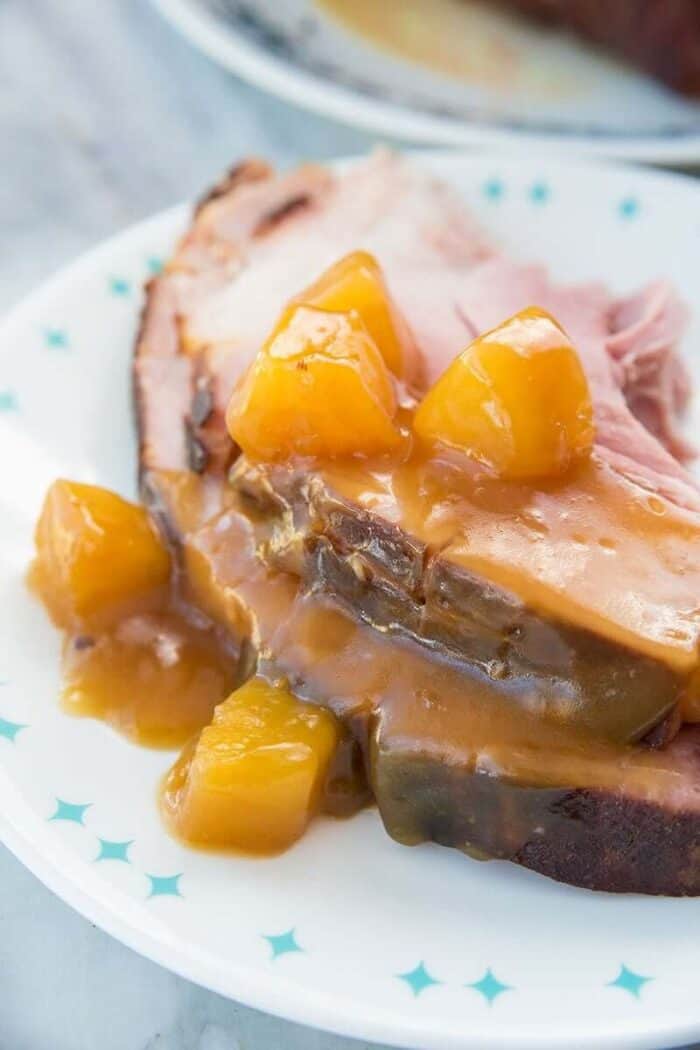 Close up of Rum Ham with pineapple tidbits in a white plate