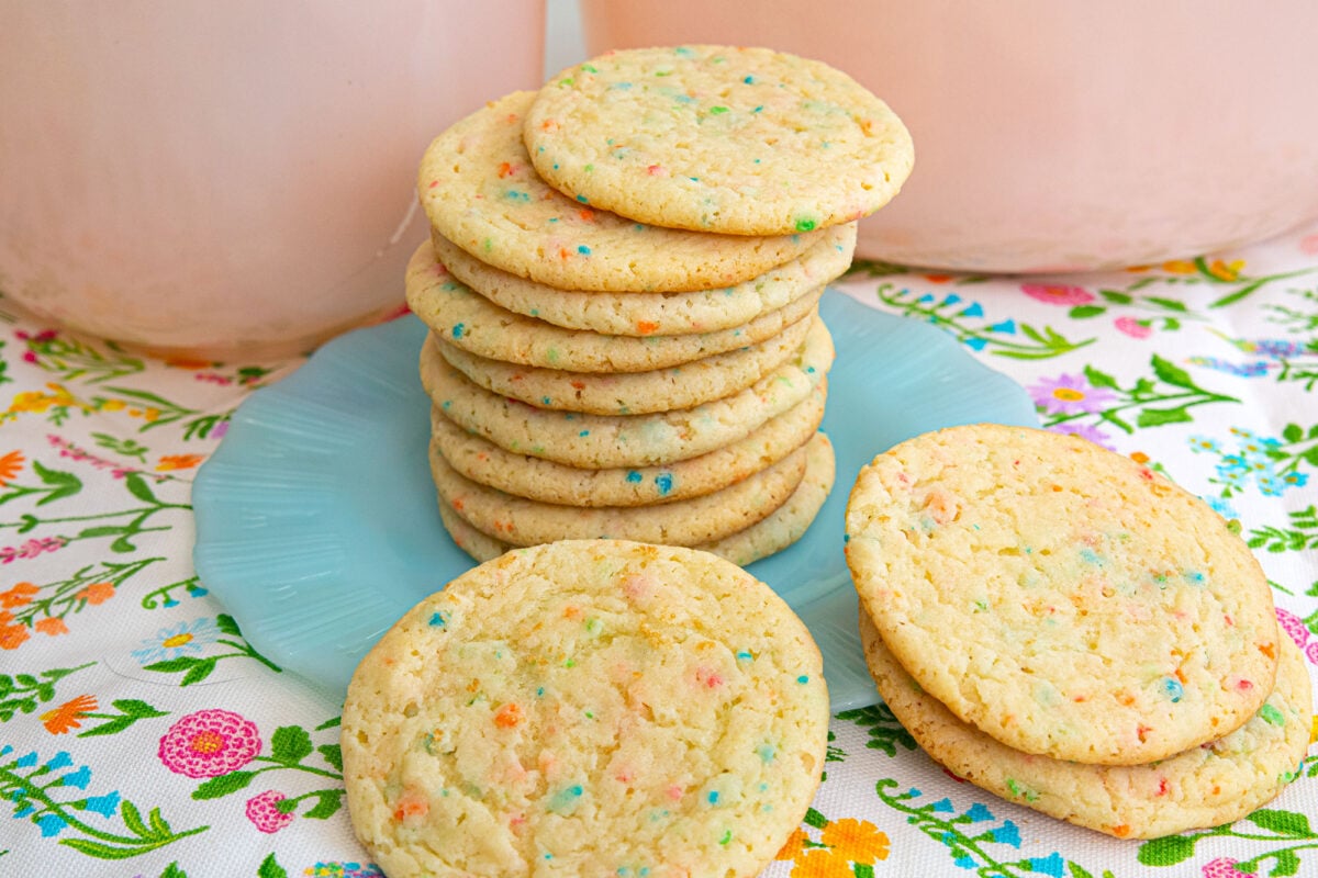 rainbow bit cake mix cookies stacked on a plate