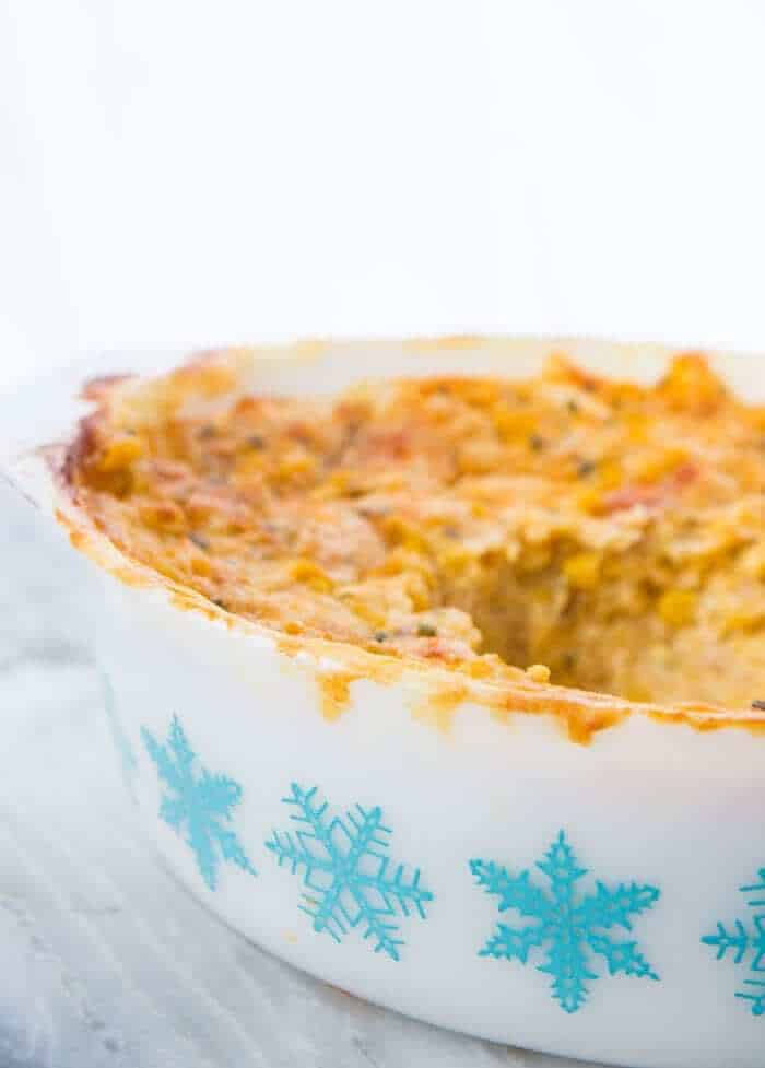Scalloped Corn Casserole in a Pyrex Turquoise Snowflake Casserole dish