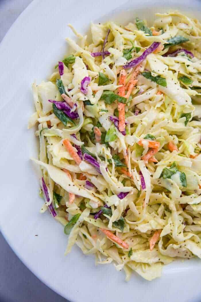 Close up of classic homemade coleslaw on a white plate