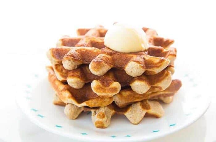 Stack of Crispy Sweet Cinnamon Keto Waffles topped with butter