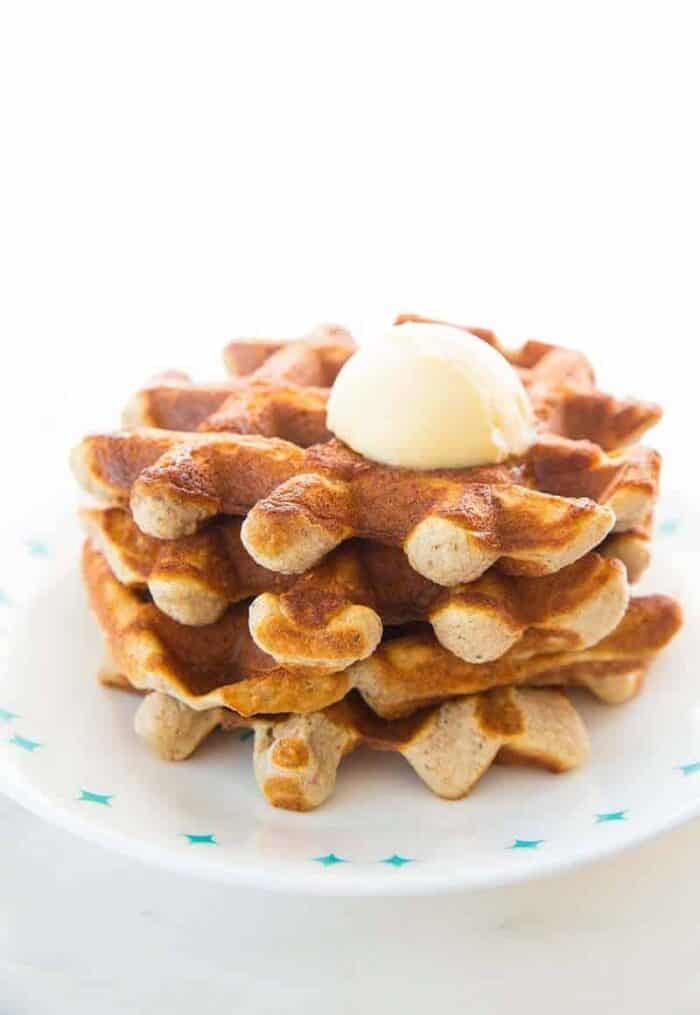 Close up of Keto waffles on a white Corelle plate and butter on top