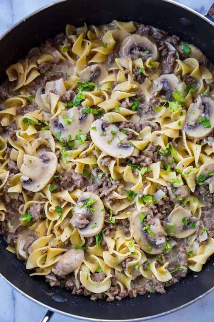 Close up of ground beef stroganoff in black skillet