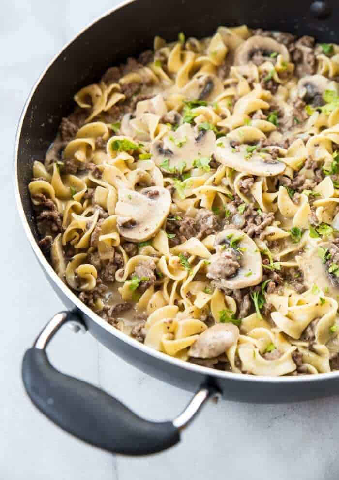 Rich & Creamy Ground Beef Stroganoff & Noodles in a black skillet